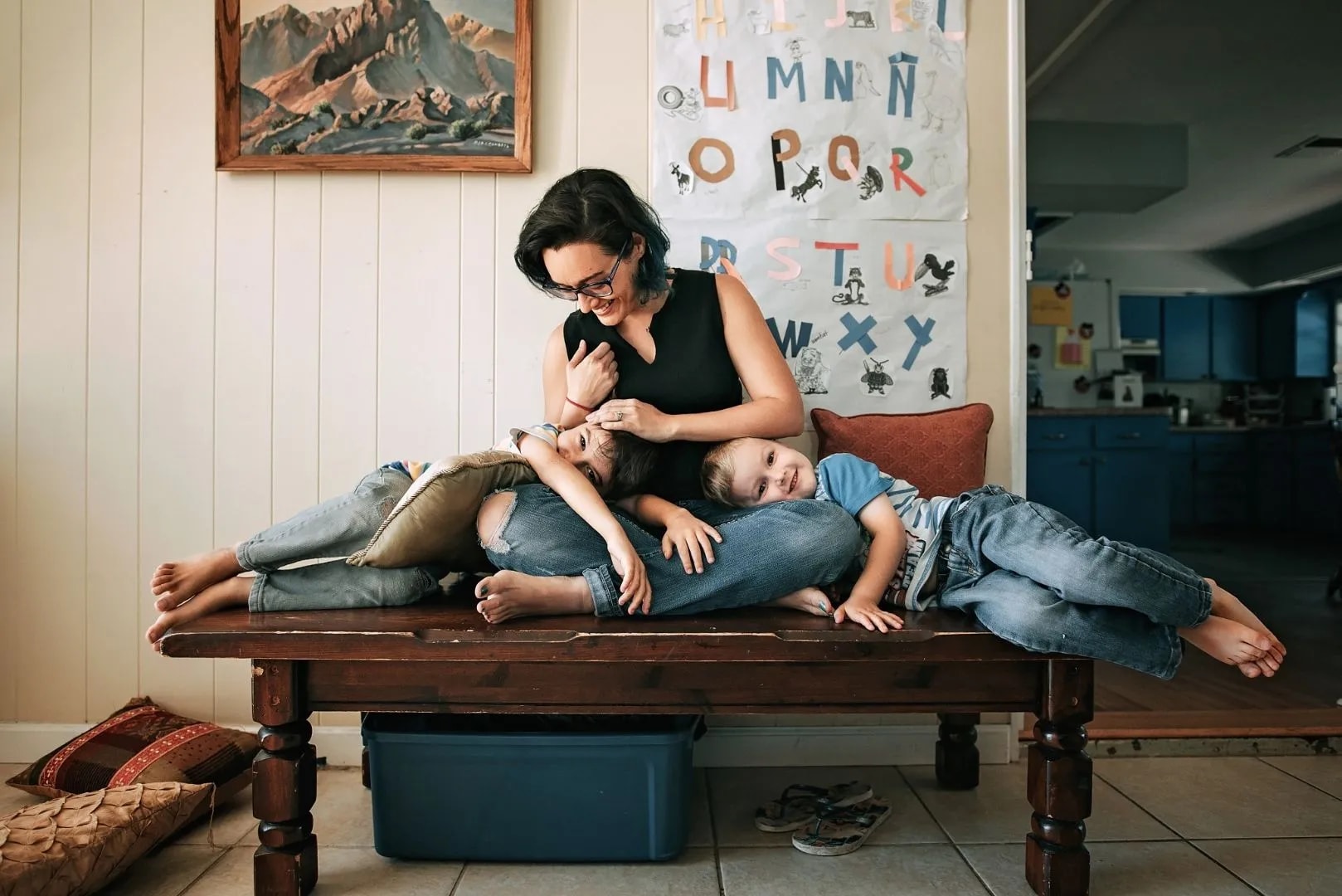 Deborah Gambrel at home with her two young children